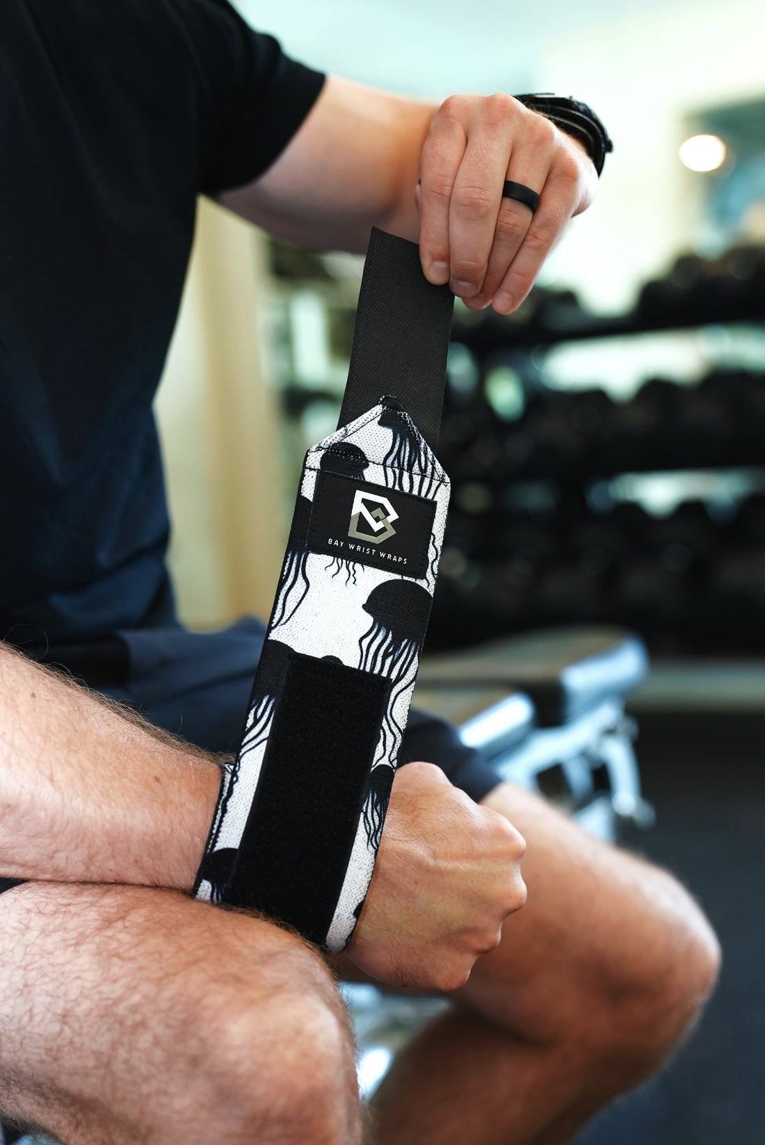 "Bay Gear Co. Jellyfish 18-inch wrist wrap next to a tape measure"