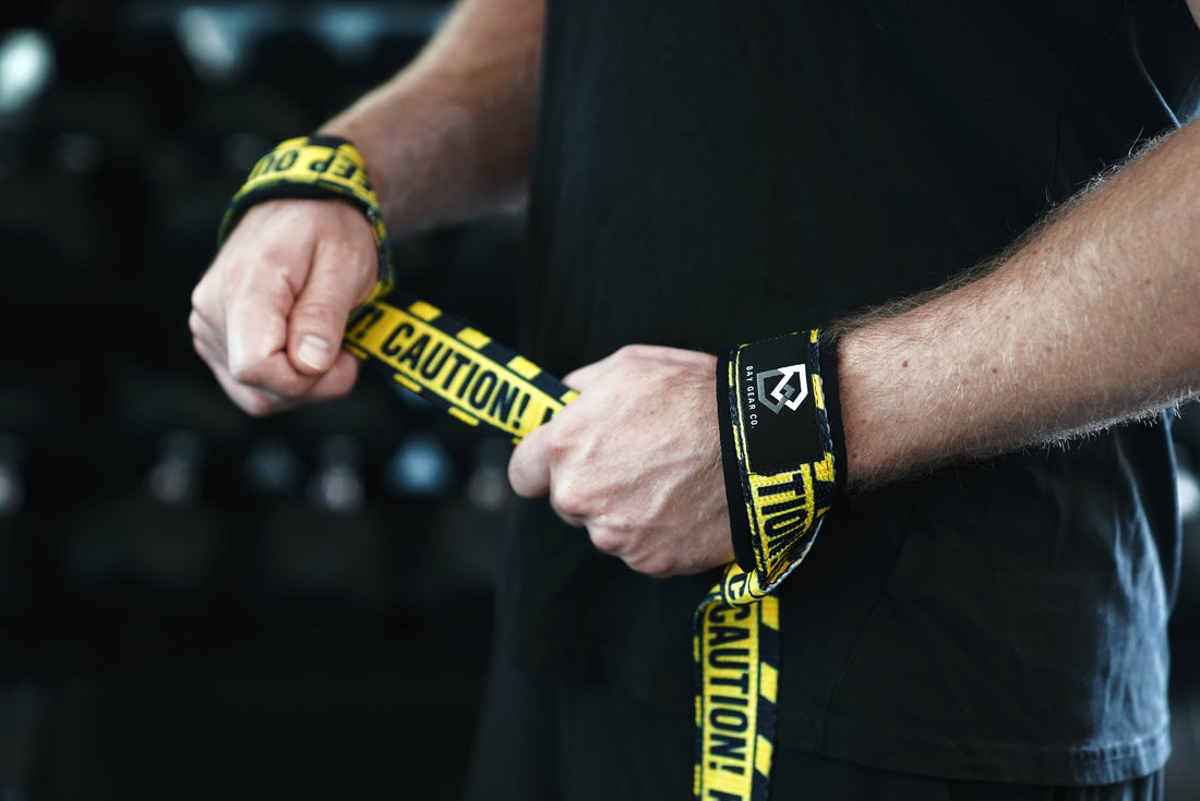 Lifting straps for lat pulldowns: Bay Gear Co. black padded straps on a pulldown bar