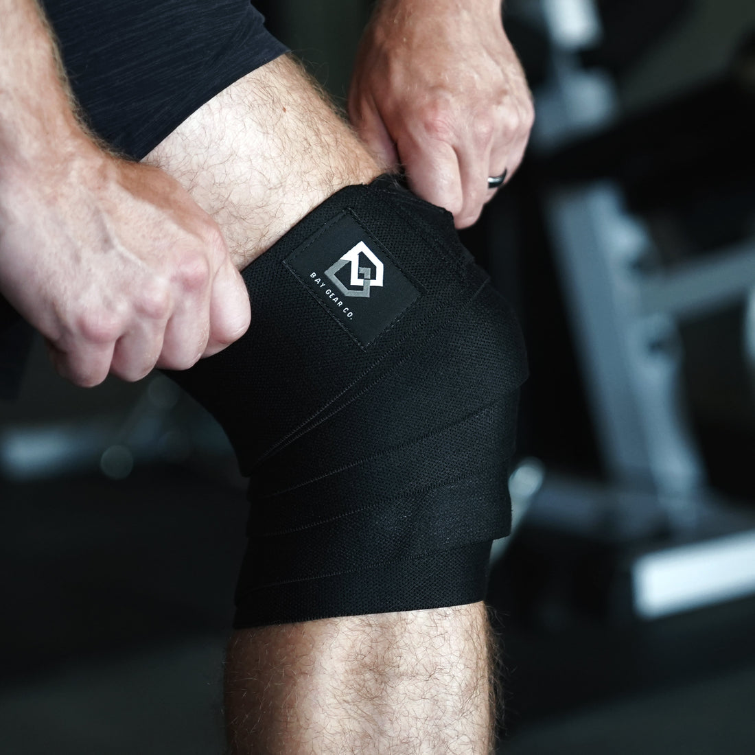 Powerlifting meet checklist with Bay Gear Co. lever belt, knee sleeves, wrist wraps and liquid chalk