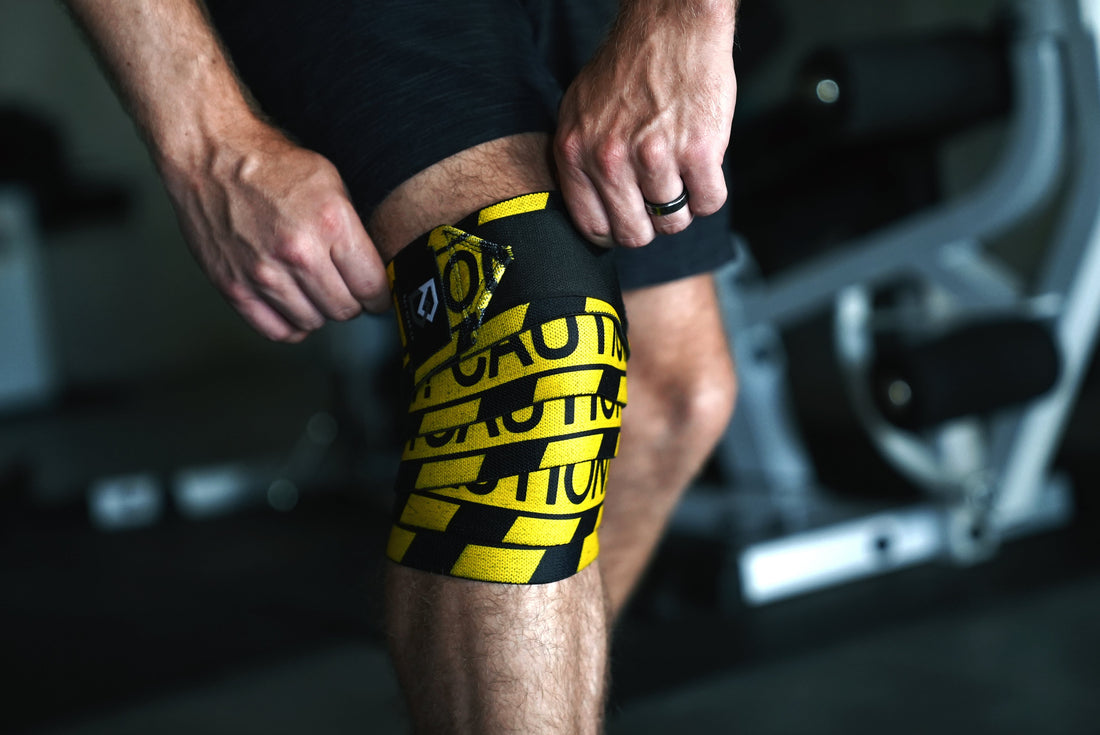 How much do knee wraps add to your squat? Lifter wrapping Bay Gear Co. caution knee wraps before a heavy squat