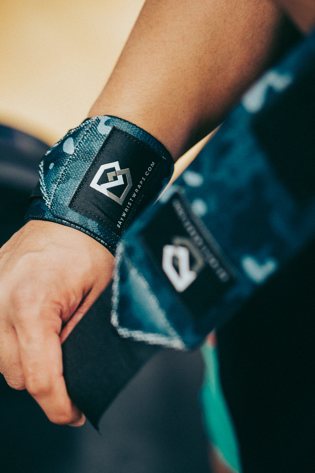 Will wrist wraps make you bench more? Lifter benching in Bay Gear Co. Black Camo wrist wraps