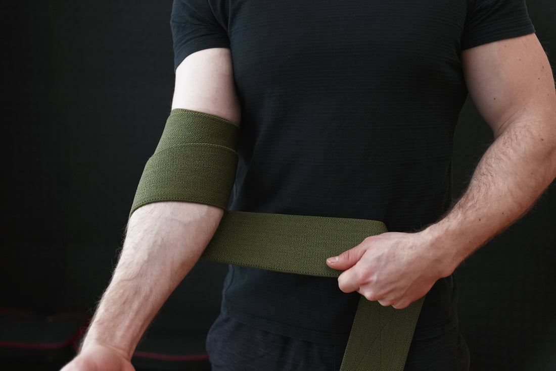 How to wrap elbow wraps for bench press: X method with Bay Gear Co. OD Green elbow wraps
