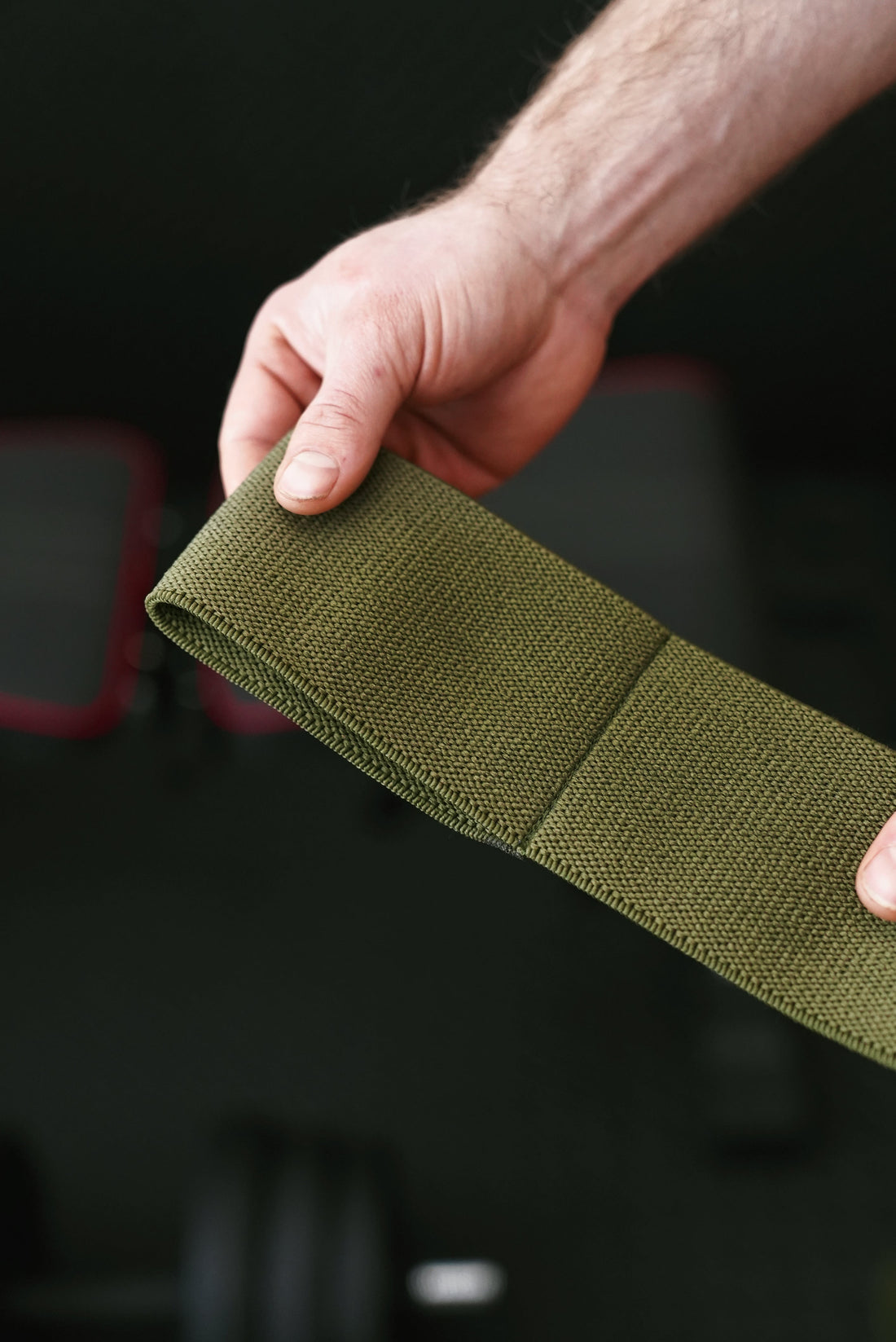 Black, OD Green and Coyote Brown elbow wraps laid flat showing the slip-on loop and hook-and-loop closure